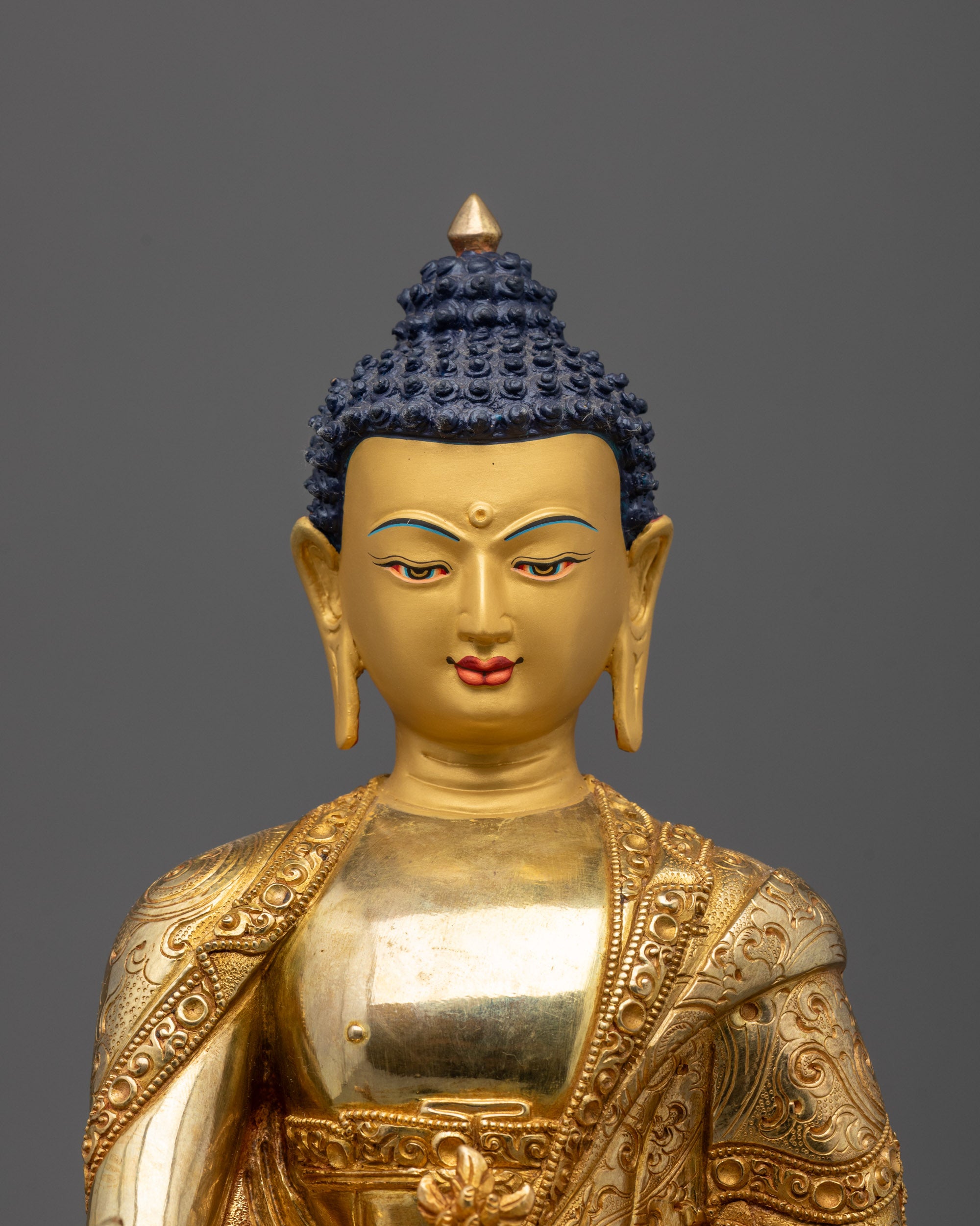 Close-up of myrobalan plant and nectar bowl in Medicine Buddha’s fire-gilded hands
