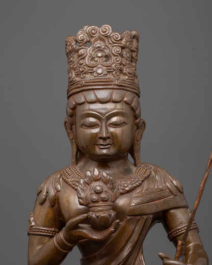 Close-up of oxidized copper Akasagarbha statue showing detailed crown and jewelry carvings