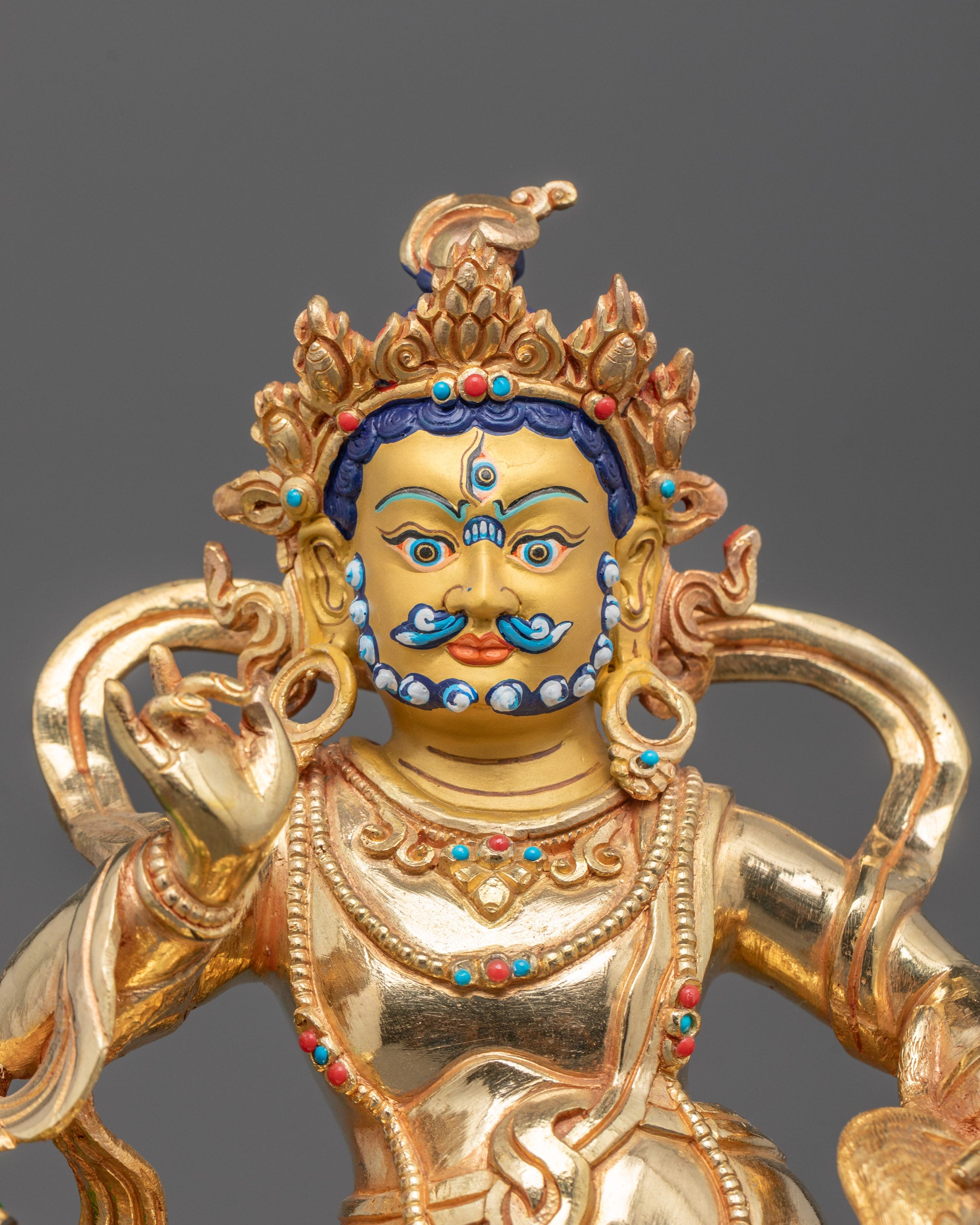 Close-up of oxidized copper Namtoshe Statue showing intricate details and gold gilding