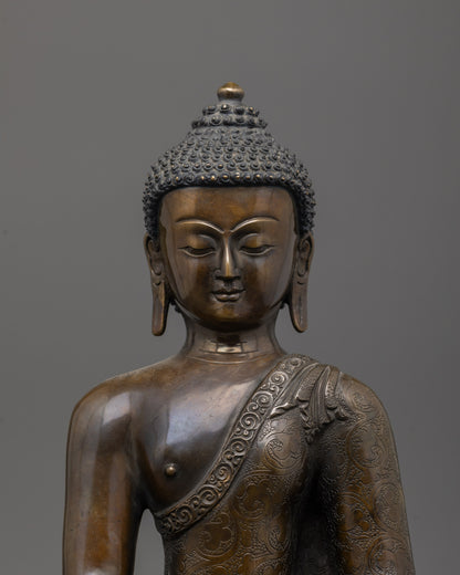 Close-up of oxidized copper face and intricate carvings on Shakyamuni Buddha statue