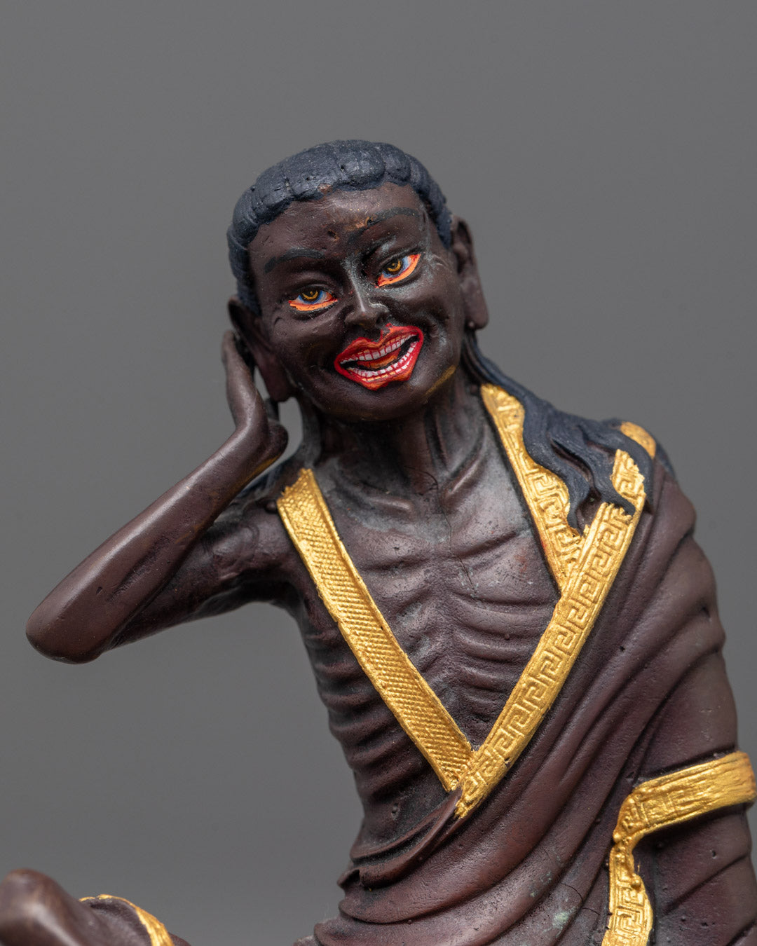 Close-up of oxidized face and detailed on Milarepa statue

