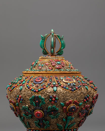 Close-up of ricepot lid featuring copper base and turquoise inlay with floral motifs