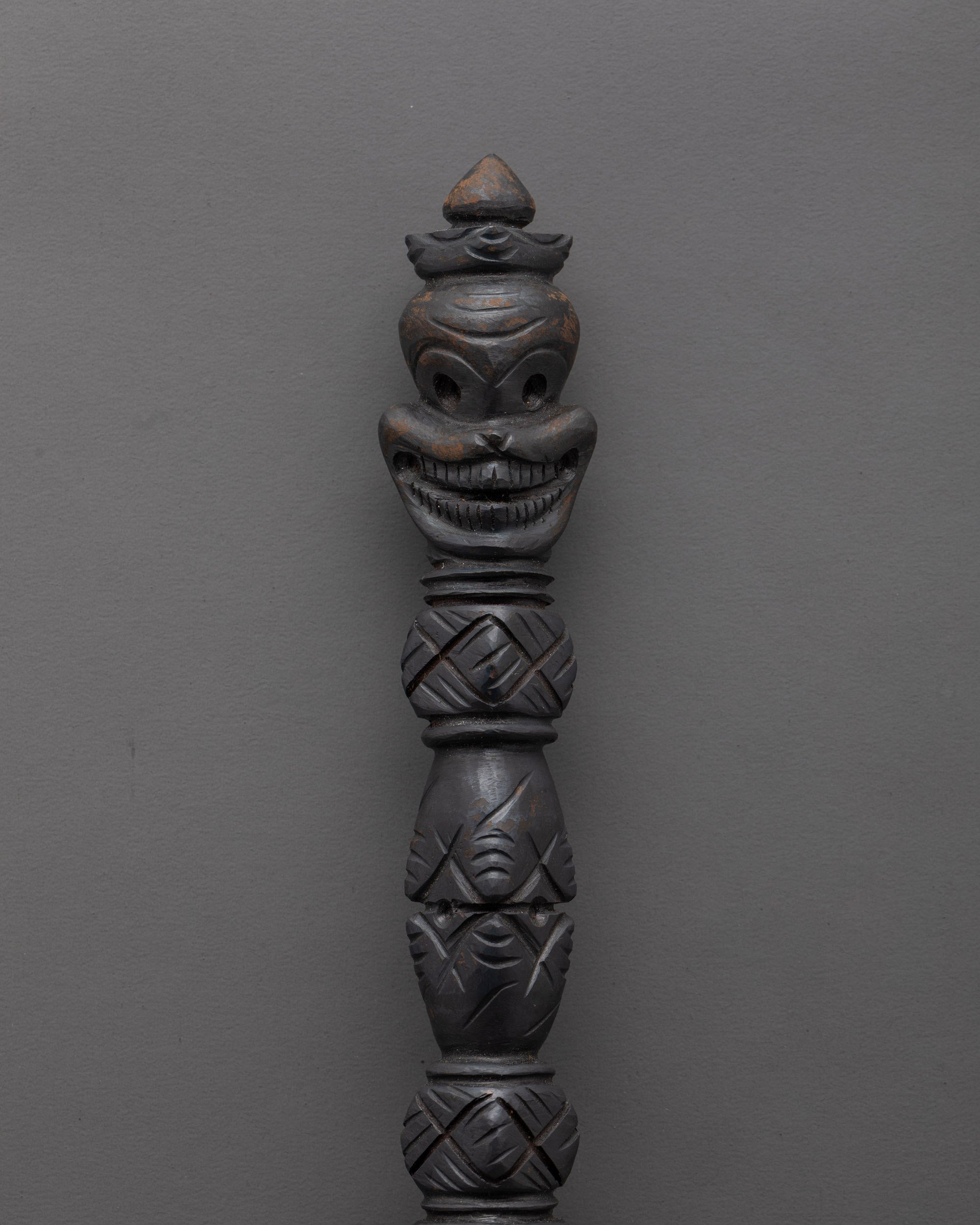 Close-up of sacred carvings on oxidized copper Phurba ritual dagger