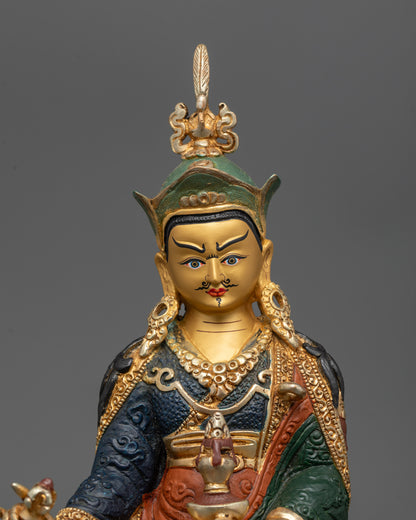 Close-up of semi-wrathful expression and intricate carvings on Painted Padmasambhava Statue