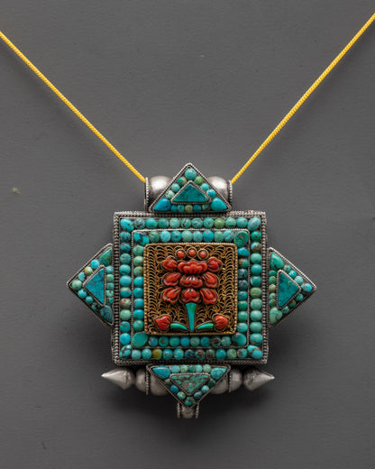Close-up of silver flower locket pendant showing gold-plated filigree and flower symbol