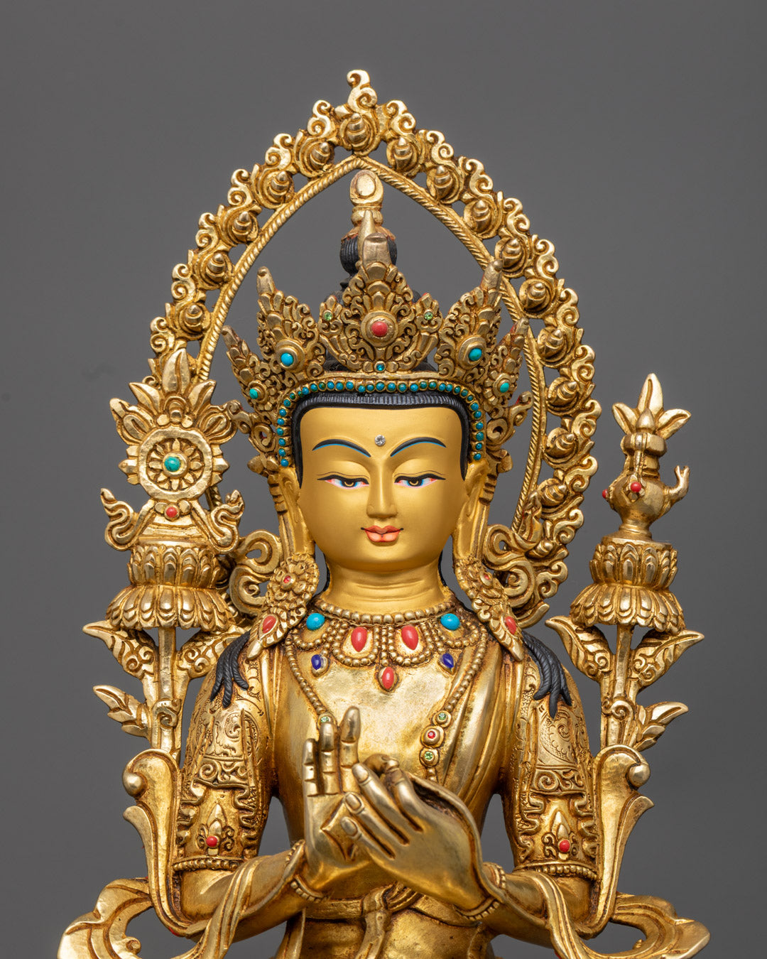 Maitreya Buddha Statue’s face made from precious stones, adorned with a radiant halo and vibrant acrylic colors.
