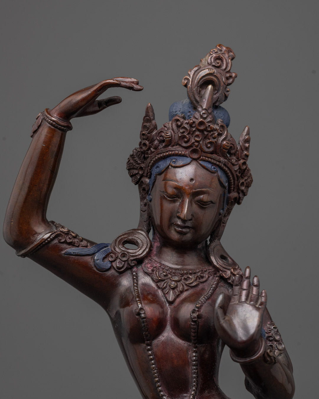 Close-up of the oxidized copper Mayadevi Statue showing traditional Nepalese
