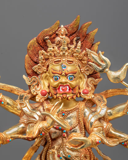 Close-up of wrathful Six Armed Mahakala’s face and detailed gold-plated copper