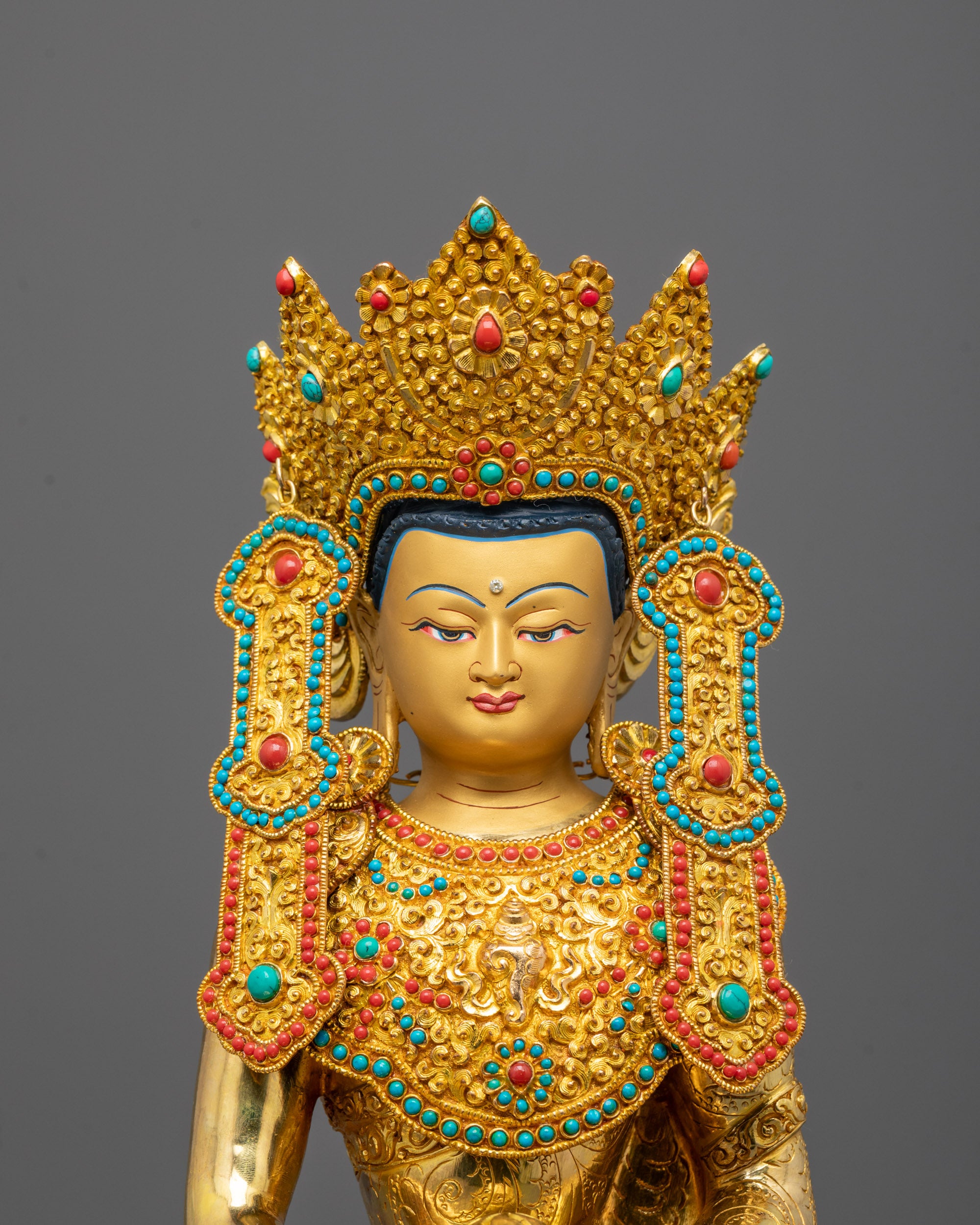 Close-up view of Amitabha Buddha’s serene expression and ornate crown