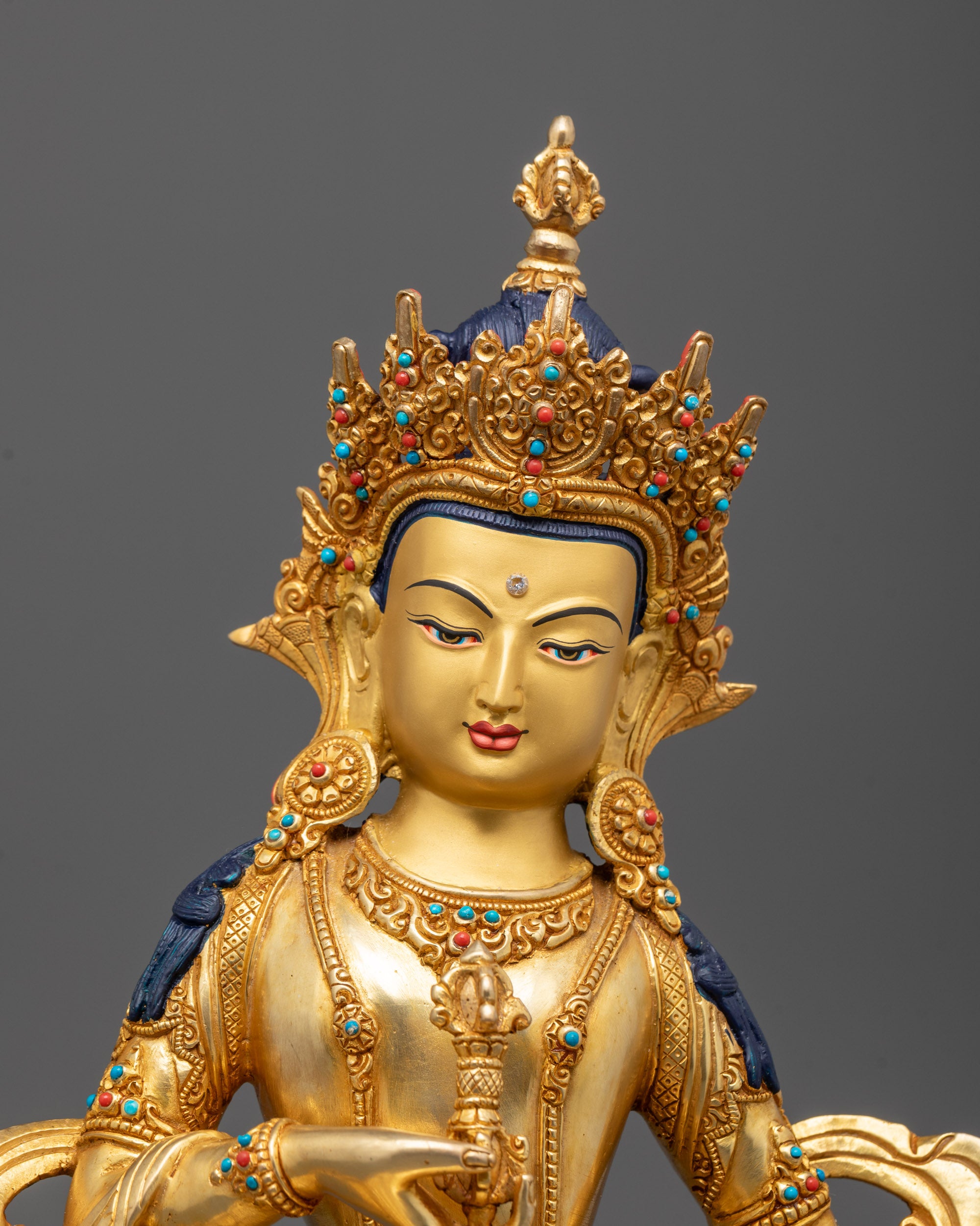 Close-up view of the Vajrasattva Statue showcasing intricate 24k gold fire-gilded