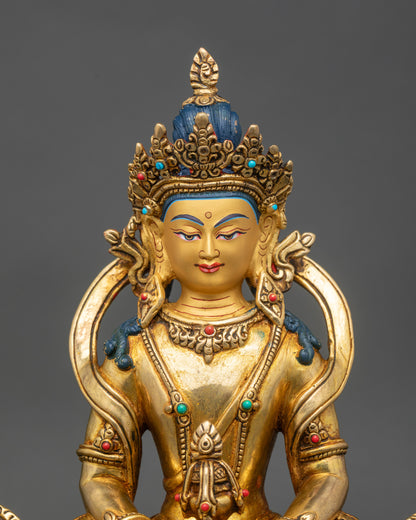 Close up Amitayus Buddha face, gold-painted, adorned with semi-precious stones, handcrafted Nepal