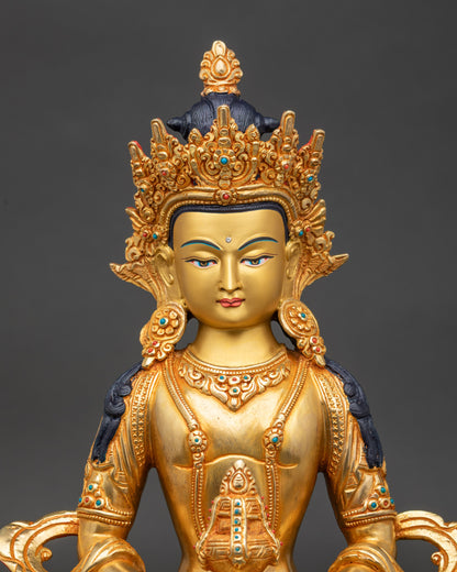 Close up Amitayus gold-painted face holding long-life vase Nepalese Buddhist deity