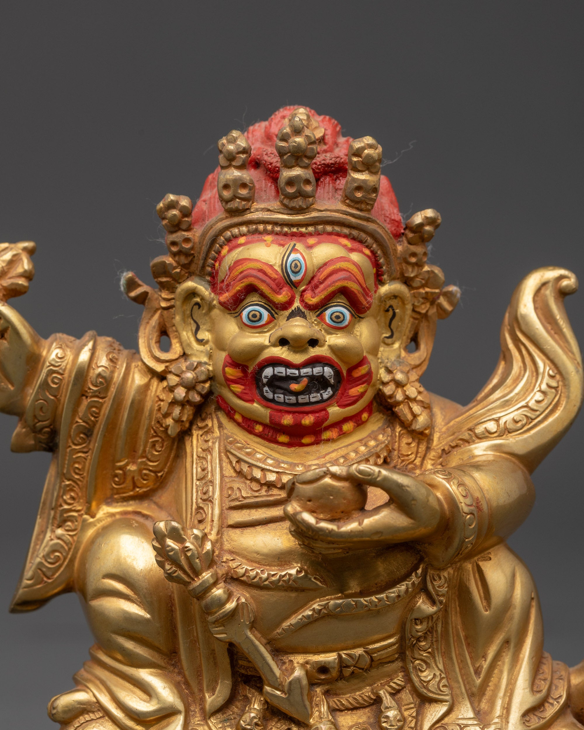 gold-gilded face and intricate details