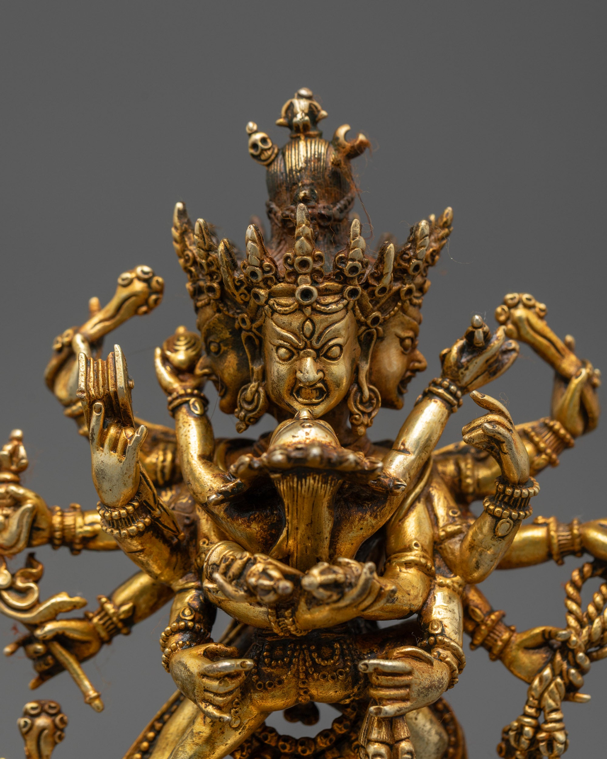 Close up Chakrasamvara holding vajra and bell, gold-fire gilded deity details