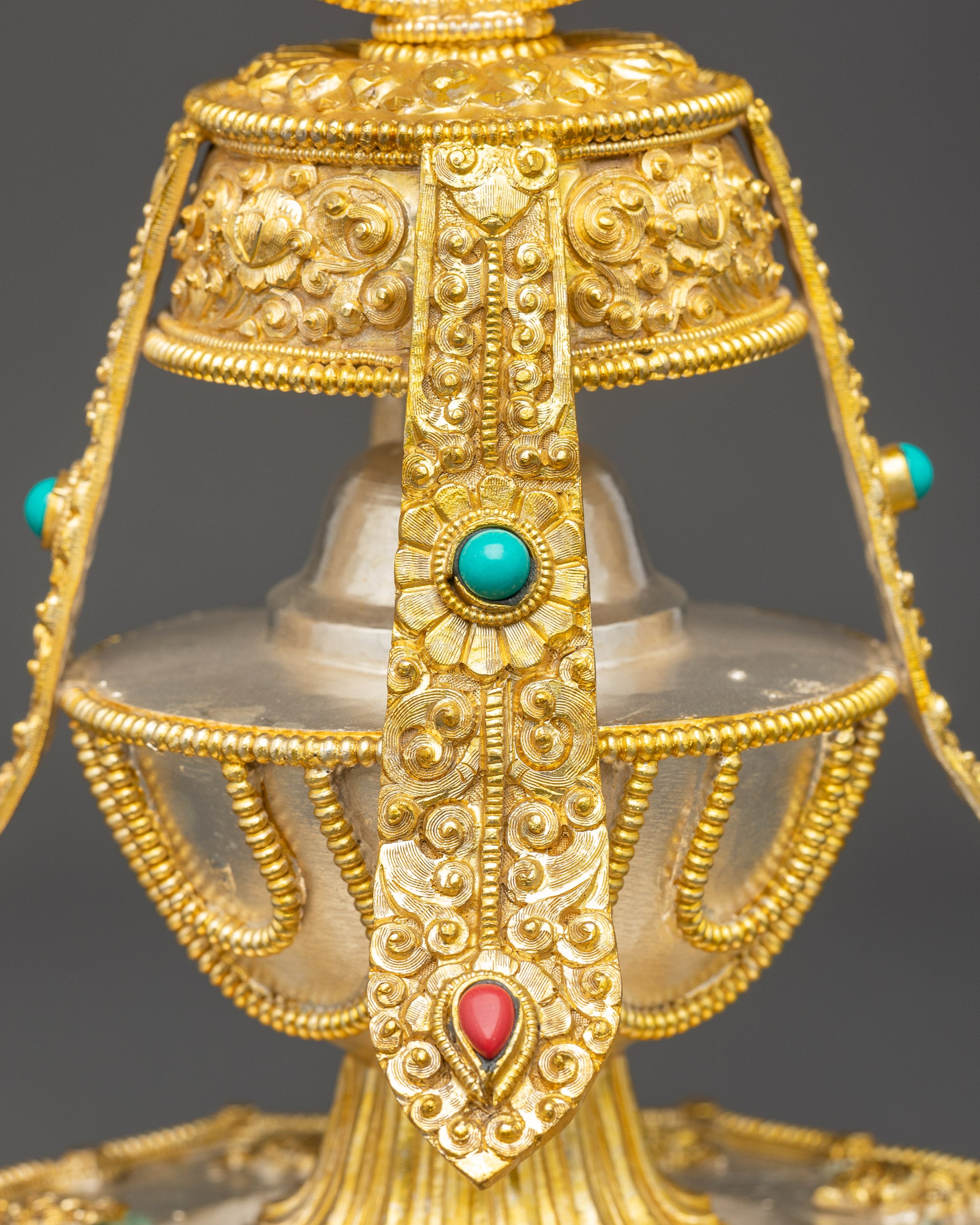 Close up Che Bumba detailing, semi-precious coral and turquoise stones, Nepalese craftsmanship