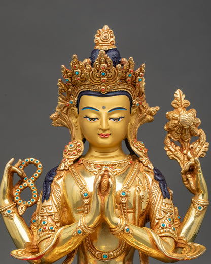 Close up Chenrezig copper statue with crown, jewelry, and sacred objects