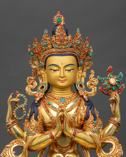Close up Chenrezig face gold-painted copper statue with semi-precious stones, Newari artisan