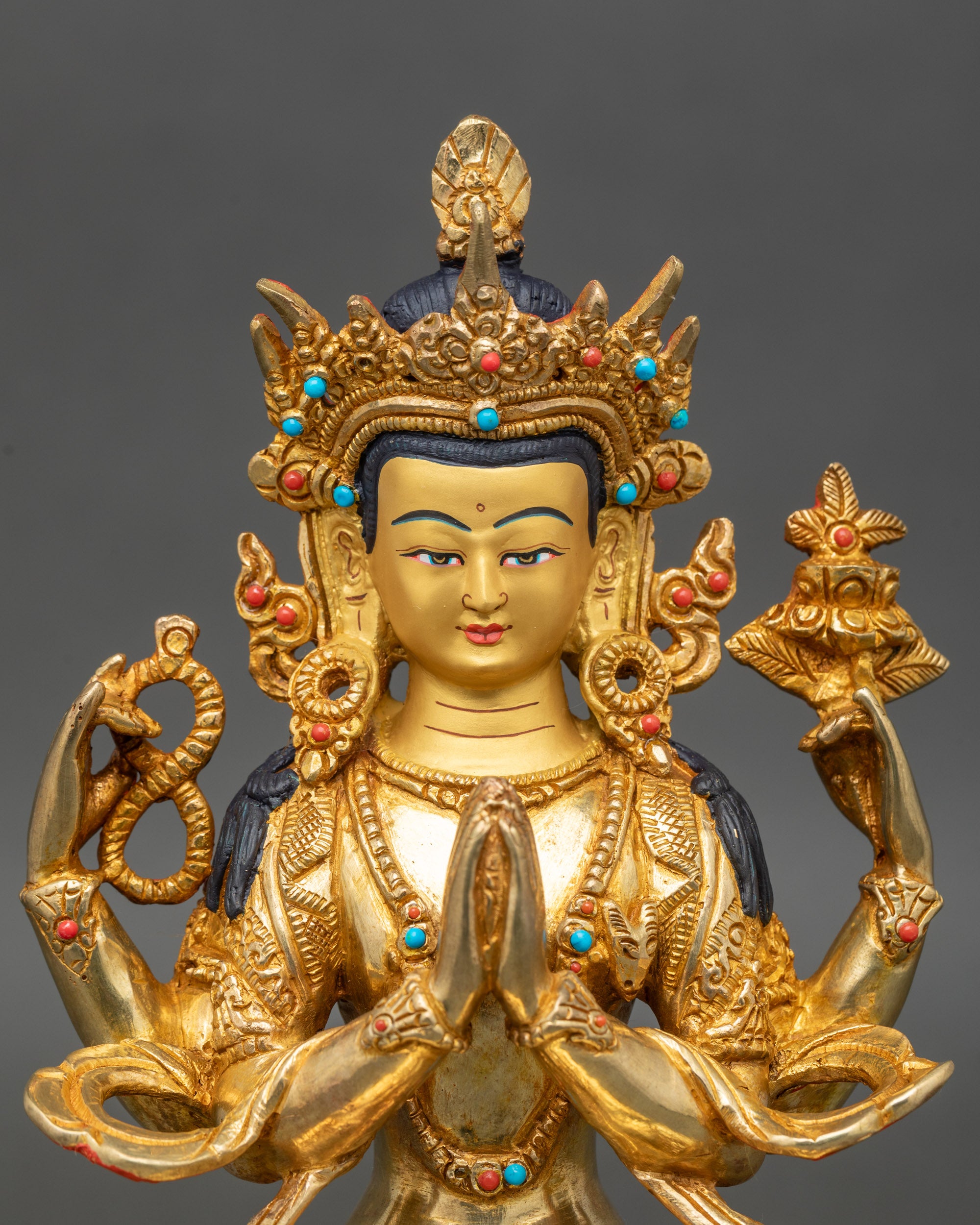 Close up Chenrezig face –  gold with intricate Newari craftsmanship details