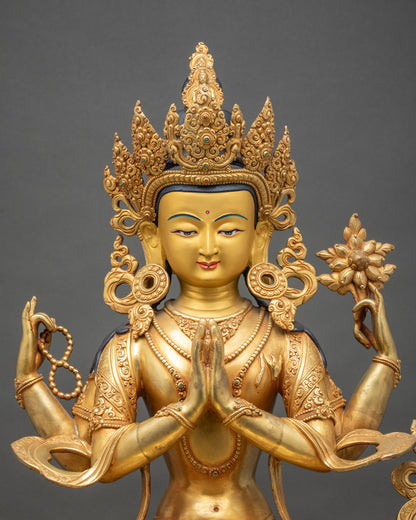Close up Chenrezig face with gold-painted features, crown, and intricate carving