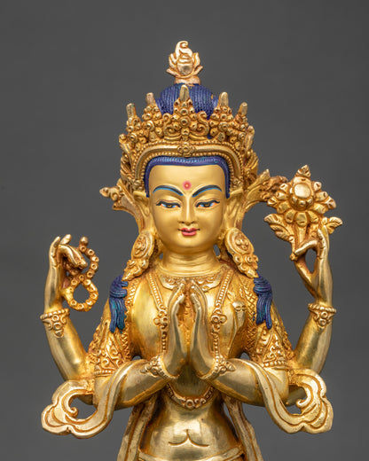 Close up Chenrezig gold-gilded face with five-jeweled crown and serene expression