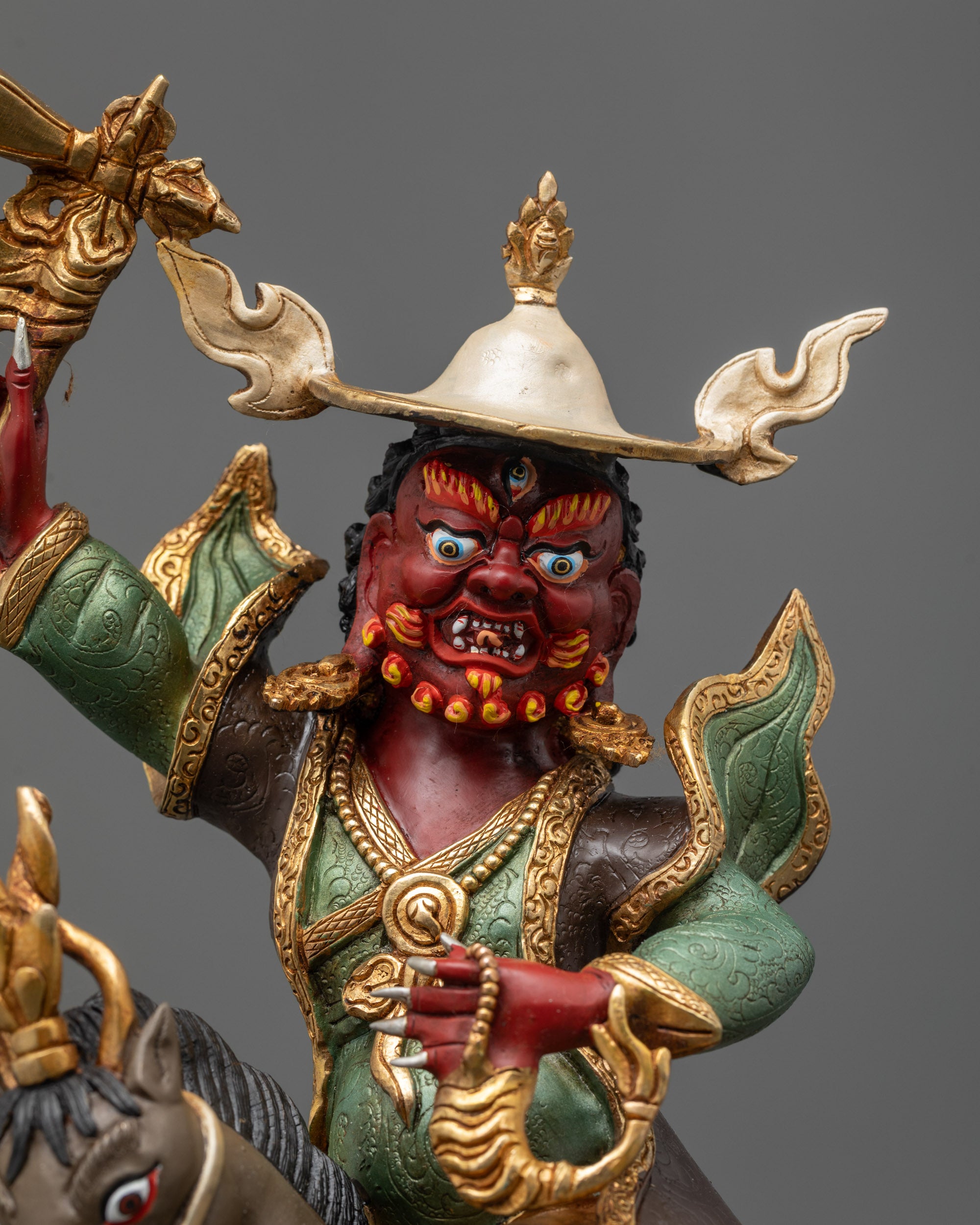 Close up Damchen Garwa Nagpo wrathful face with third eye and halo
