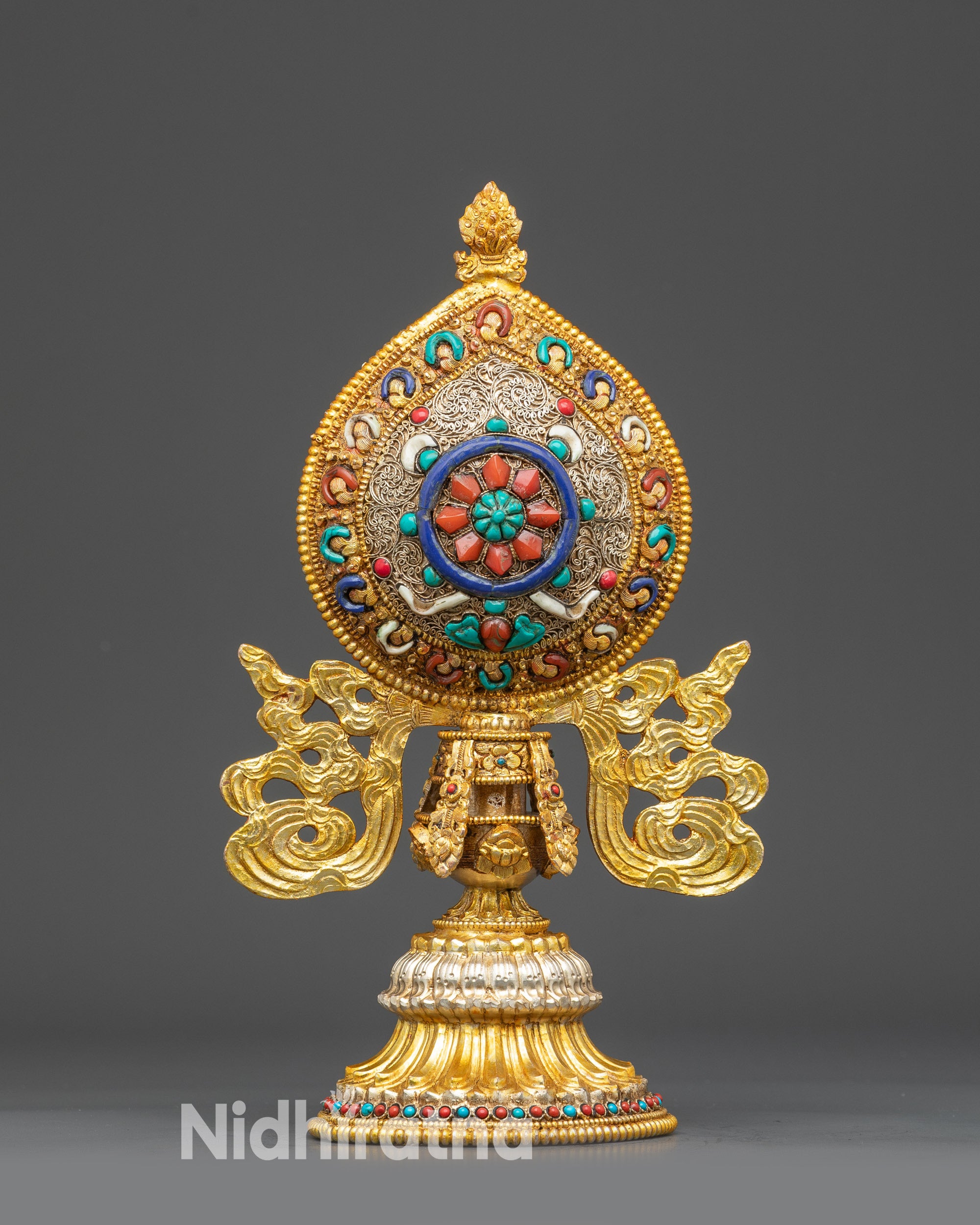 Close up Dharma Wheel (Dharmachakra) from Ashtamangala set, copper & semi-precious stones