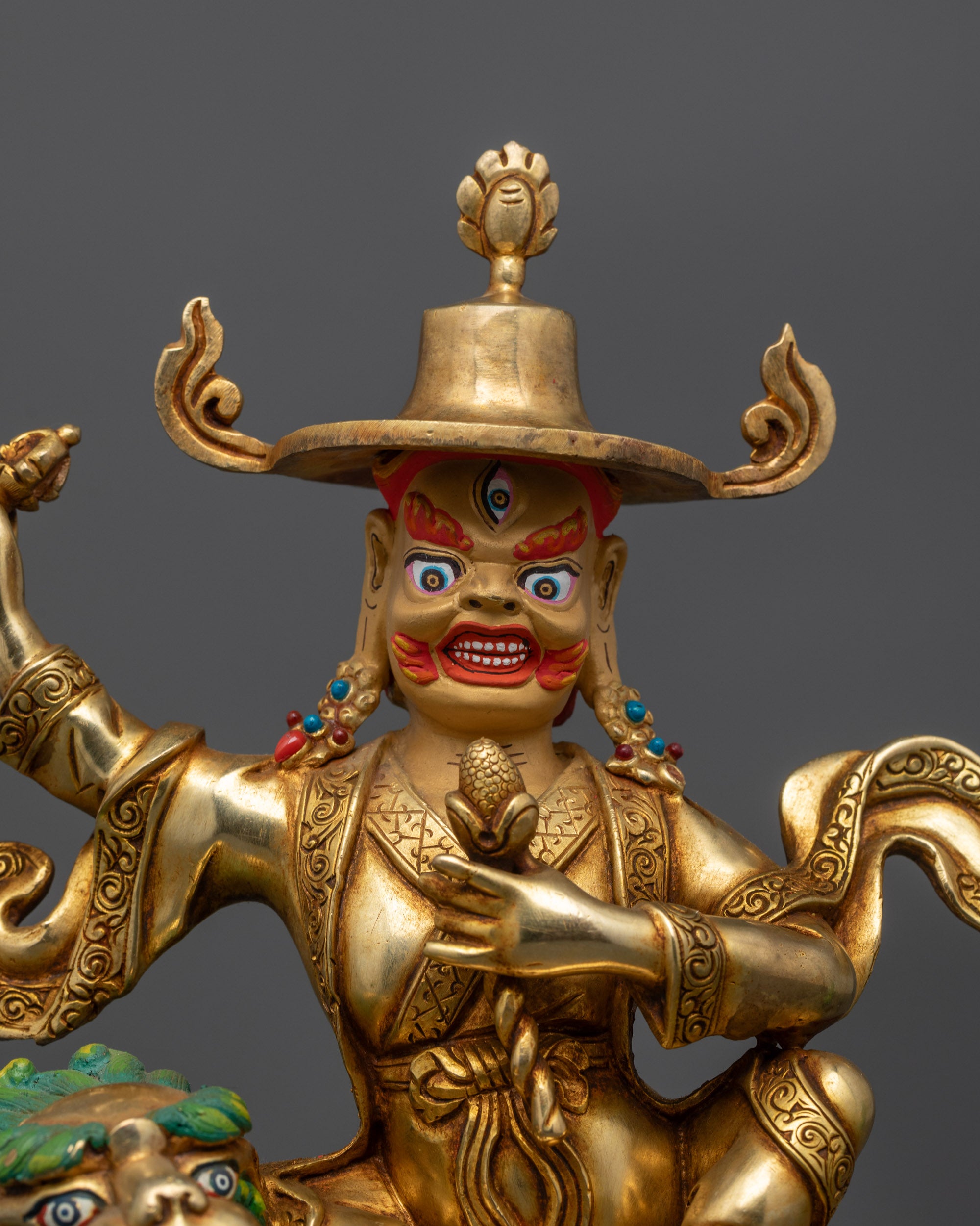 Close up Dorje Legpa Statue wrathful face holding vajra
