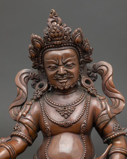 Close up Dzambhala statue showing mongoose and citron fruit, Newari handcrafted detail