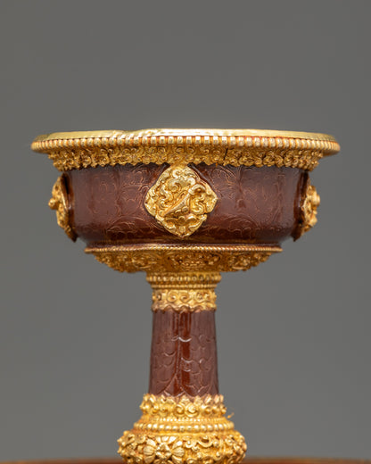 Close up Golden Serkyem Offering showing handcrafted copper and gold-plated details

