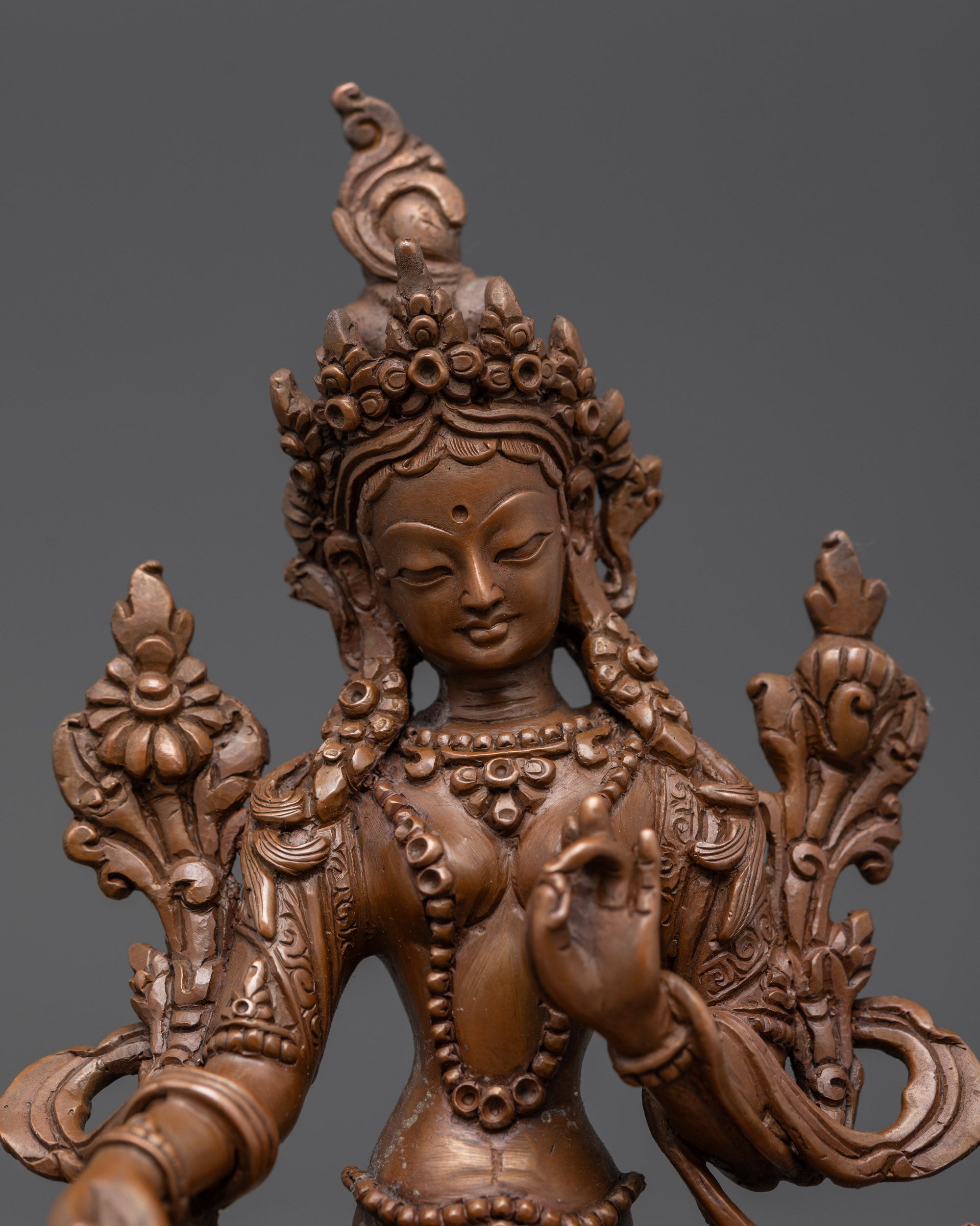 Close up Green Tara Statue showing intricate robe and jewelry details
