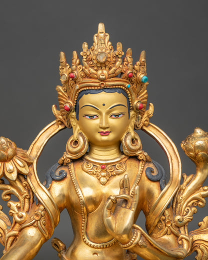 Close up Green Tara face, gold-painted with coral and turquoise stones, handcrafted Newari art