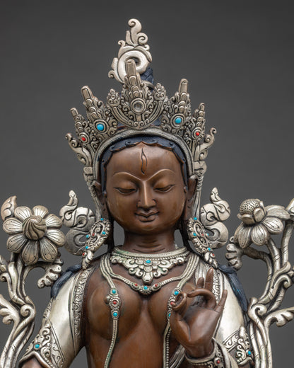 Close up Green Tara face with crown, jewelry, and Utpala flower details