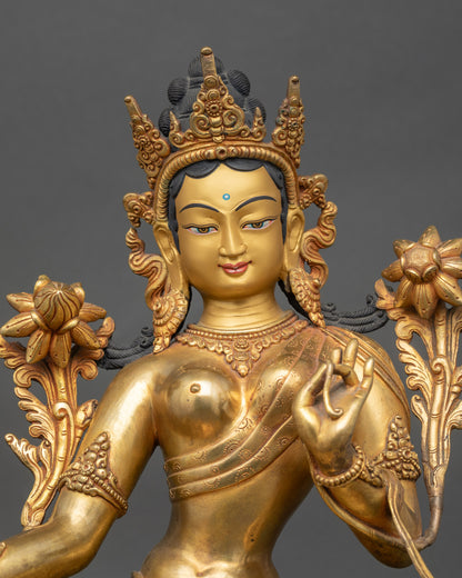 Close up Green Tara face with gold-painted finish, Nepalese handcrafted Buddhist statue