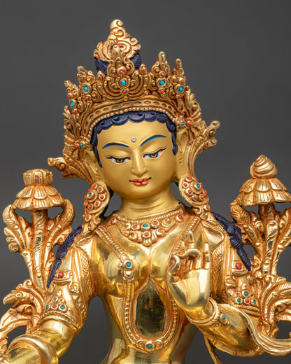 Close up Green Tara gold painted face crown semi precious stones Newari craftsmanship