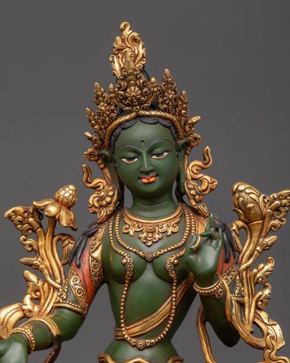 Close up Green Tara holding utpala flower with five-jeweled crown details