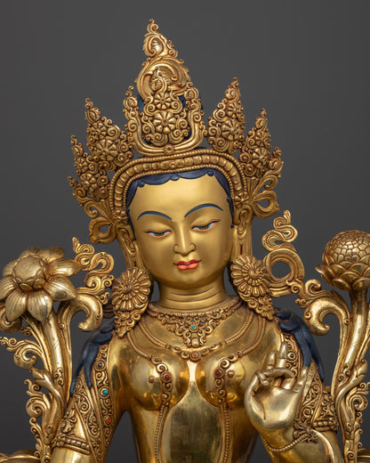 Close up Green Tara serene face with intricate carvings and Utpala lotus stem, handmade Himalayan Buddhist art