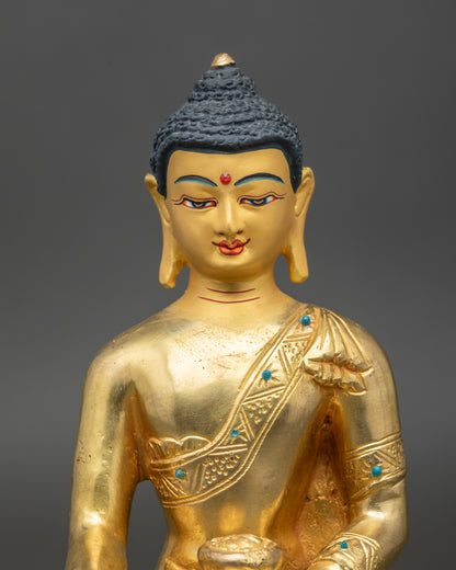 Close up – Handcrafted Newari Shakyamuni Buddha face with gold-painted features, spiritual art