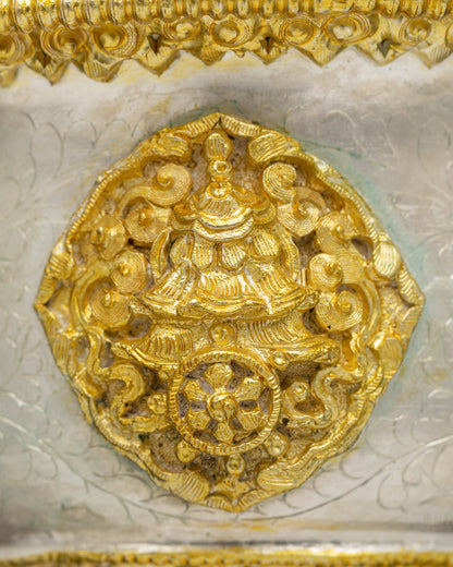 Close up Himalayan copper Butter Lamp with intricate Buddhist symbolism