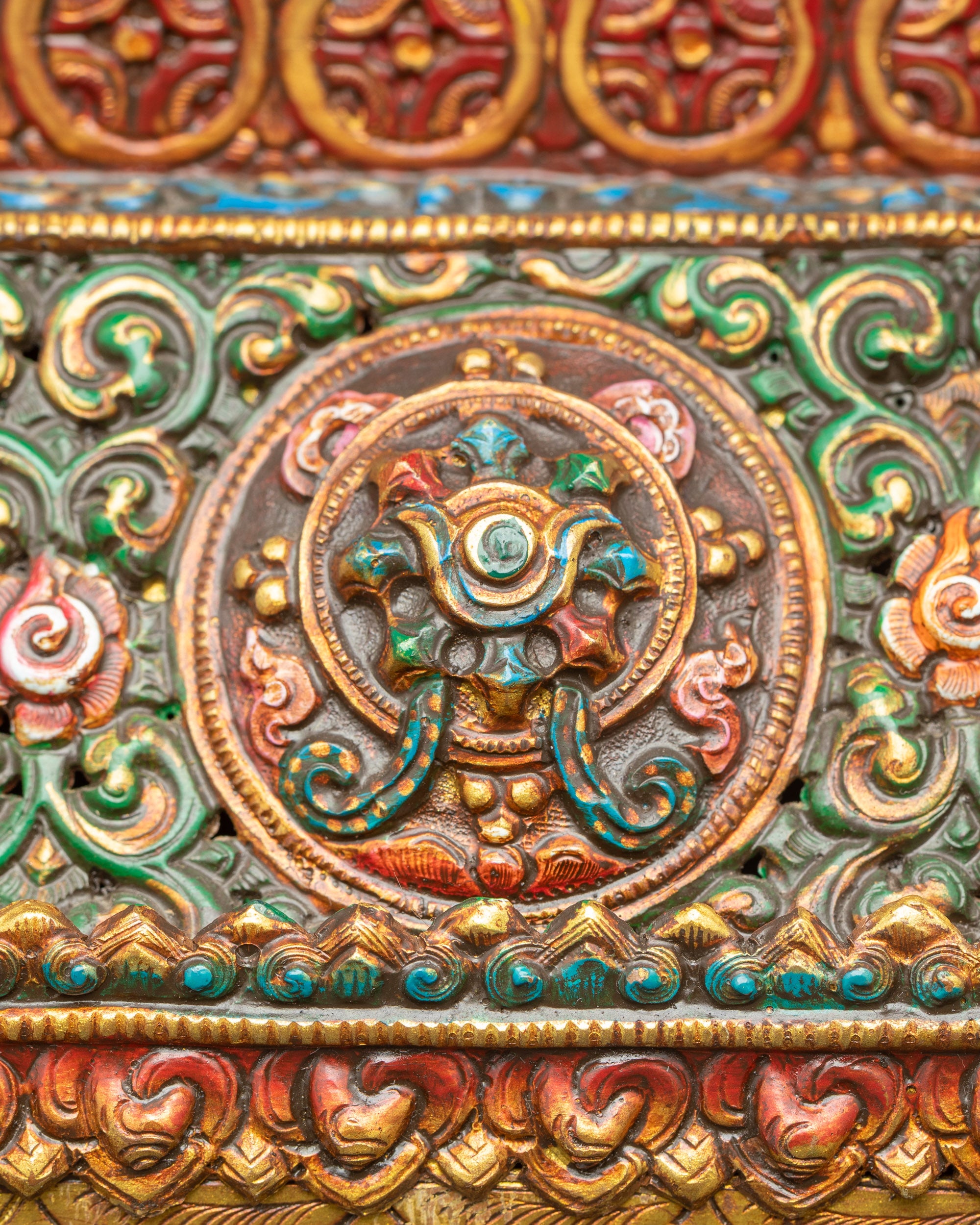 Close up Himalayan copper incense burner with auspicious symbols and gold finish