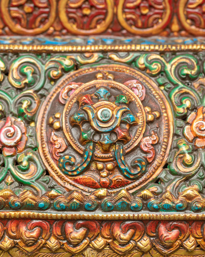 Close up Himalayan copper incense burner with auspicious symbols and gold finish