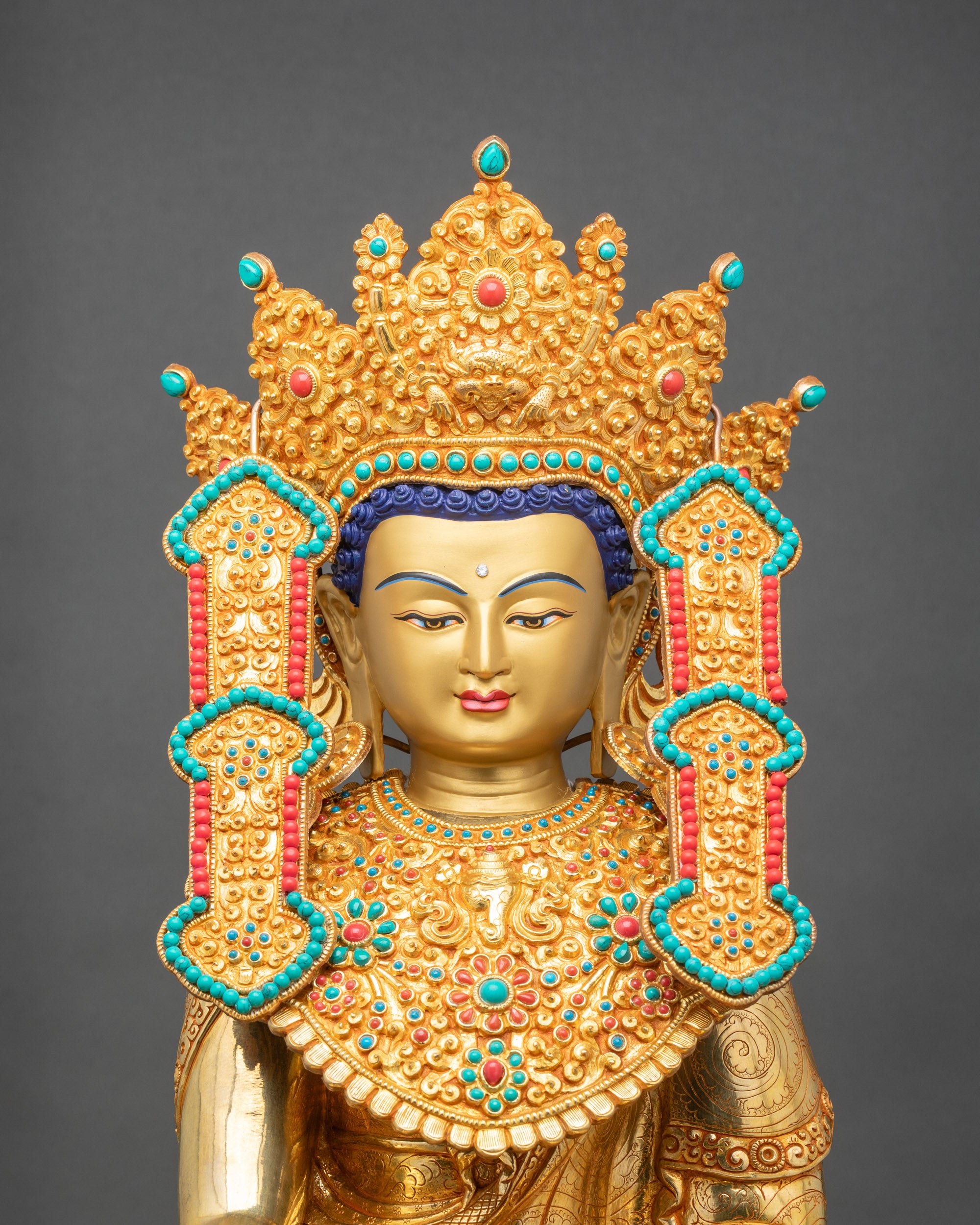 Close up Jowo Rinpoche face with Five-Buddha Crown, golden details, and serene expression
