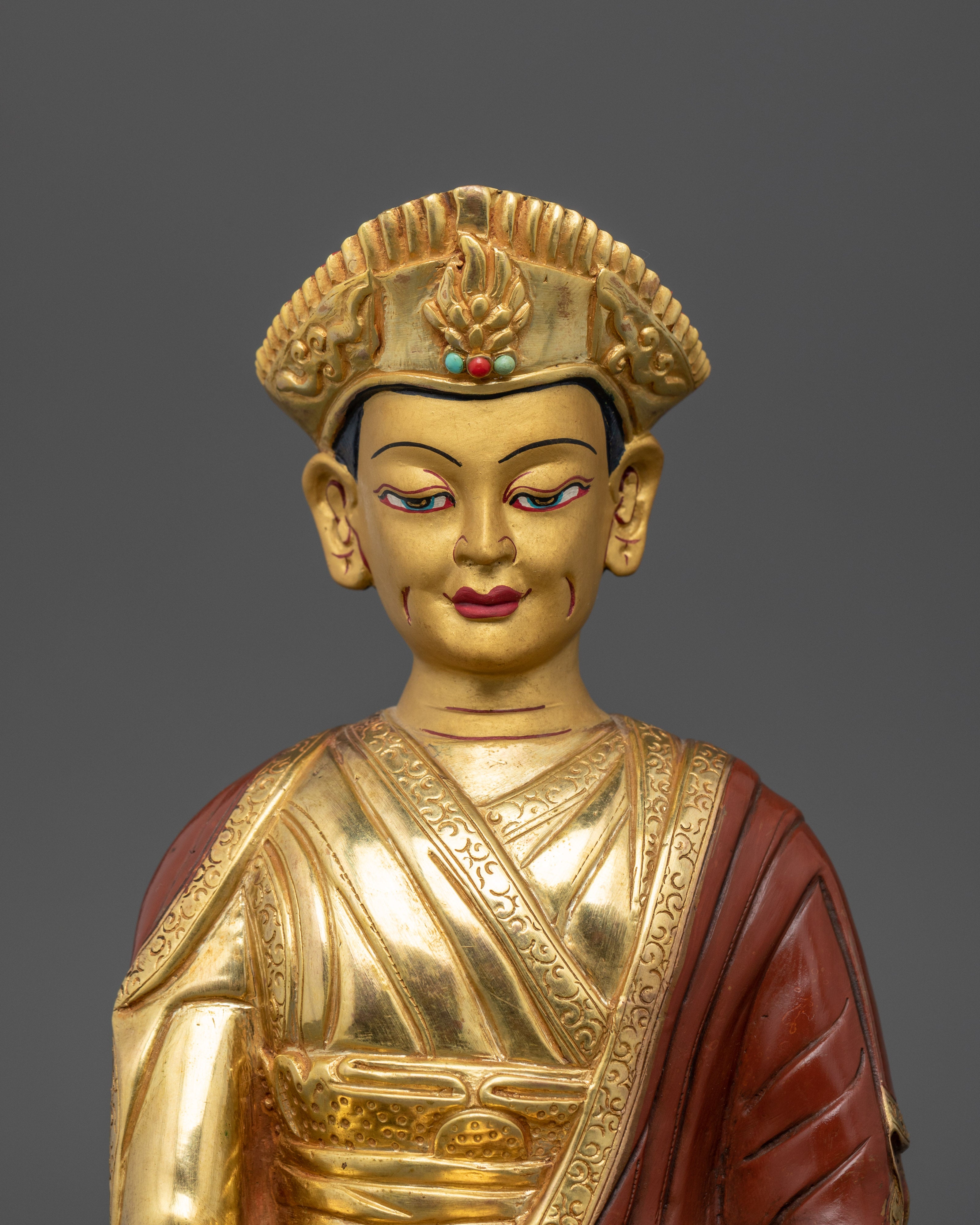 Close up Karmapa gold-painted face crown semi-precious stones hand-painted details