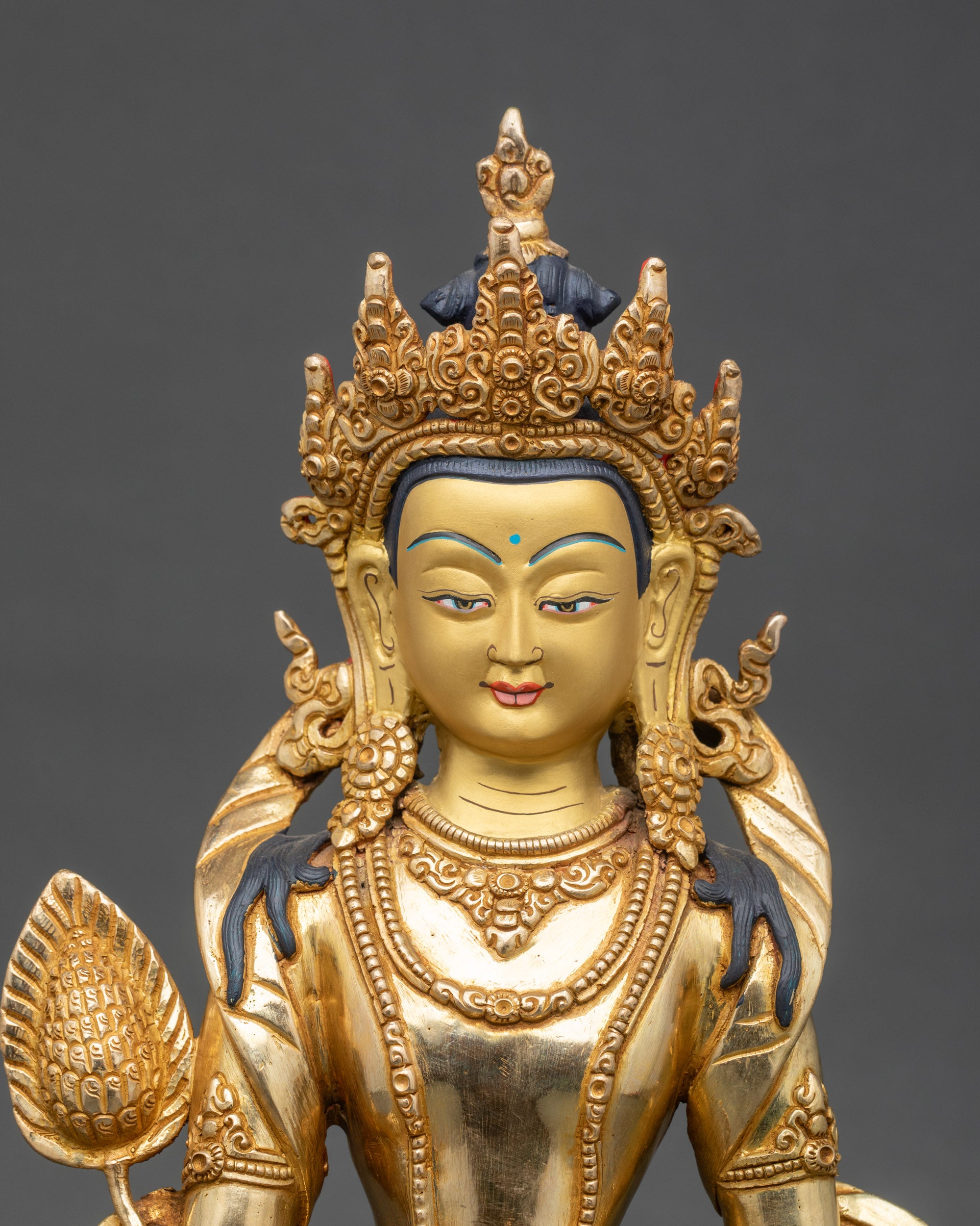 Close up Kshitigarbha Bodhisattva statue chintamani wheat stalk intricate details