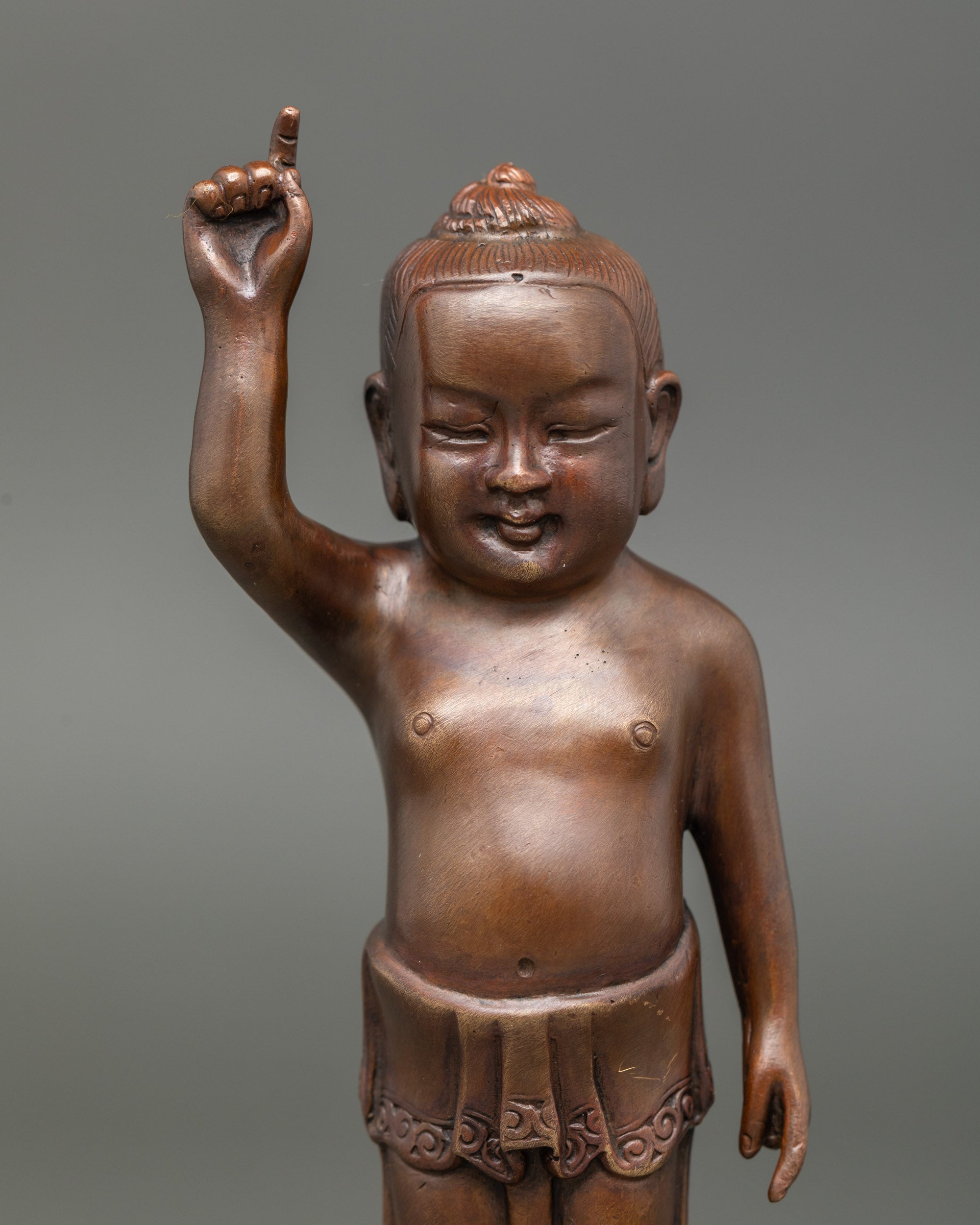 Close up Littel Buddha sculpture handcrafted in Nepal with oxidized finish 