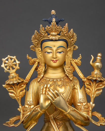 Close up Maitreya Buddha face and Dharmachakra mudra, gold-painted Himalayan sculpture