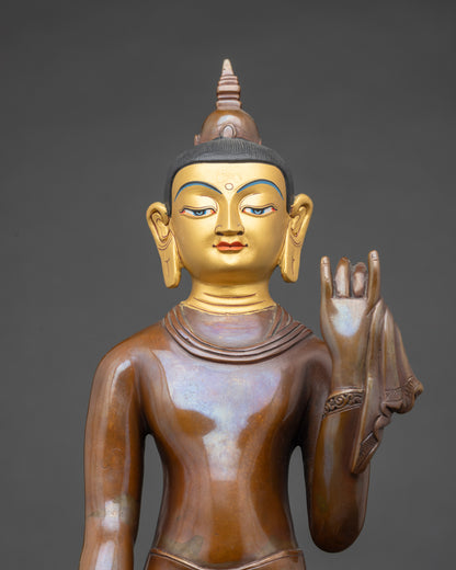 Close up Maitreya Buddha face gold-painted face oxidized copper Buddhist statue handmade Nepal