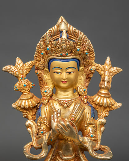 Close up Maitreya Buddha gold-painted face adorned with semi-precious stones