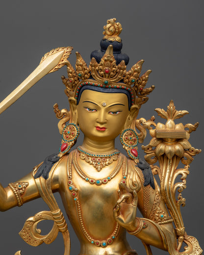 Close up Manjushri gold-gilded face with peaceful expression and majestic halo