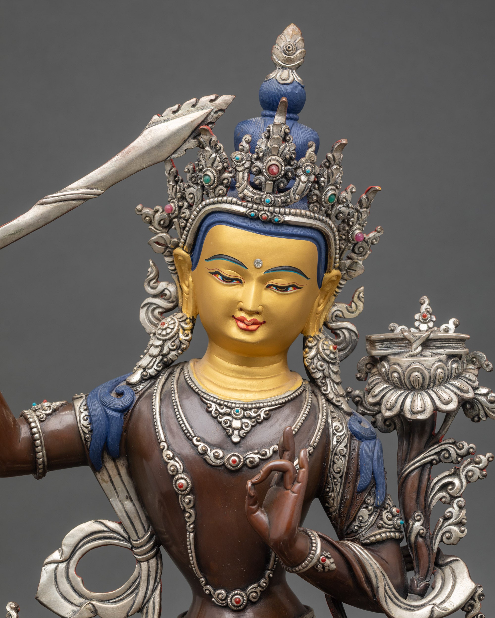 Close up Manjushri raised sword semi-precious stones silver-plated Himalayan art