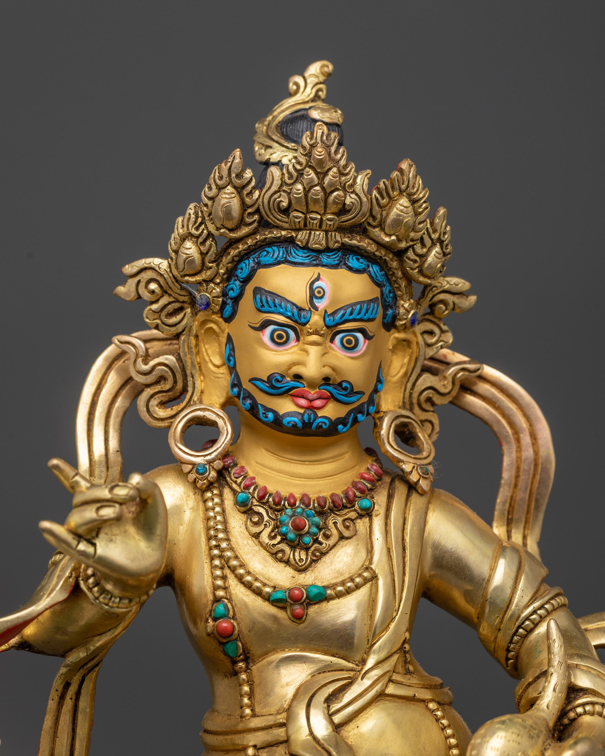 Close up Namtoshe Statue showing intricate carvings and semi-precious stone robe details
